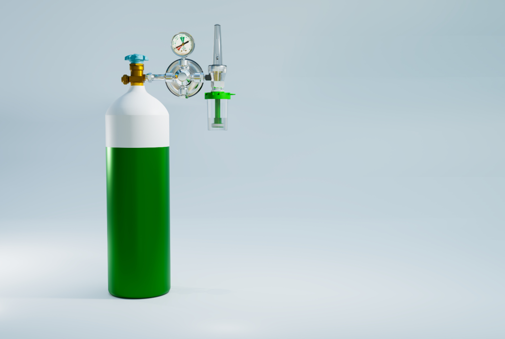 Cilindro de oxigênio medicinal com válvula, manômetro e fluxômetro acoplados, utilizado para terapia de oxigenoterapia domiciliar e hospitalar. Equipamento essencial no suporte respiratório e no atendimento de emergências.