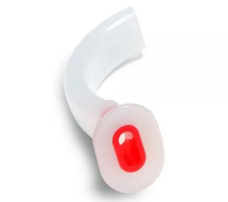 Cânula orofaríngea tipo Guedel utilizada para manter as vias aéreas abertas em pacientes inconscientes. O dispositivo médico é inserido na boca para evitar obstrução da via aérea pela língua durante procedimentos de emergência ou ventilação assistida.